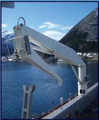 White davit crane on a ship in a fjord